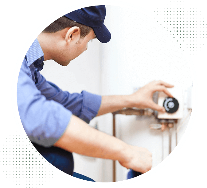 A man working on a wall with a drill.